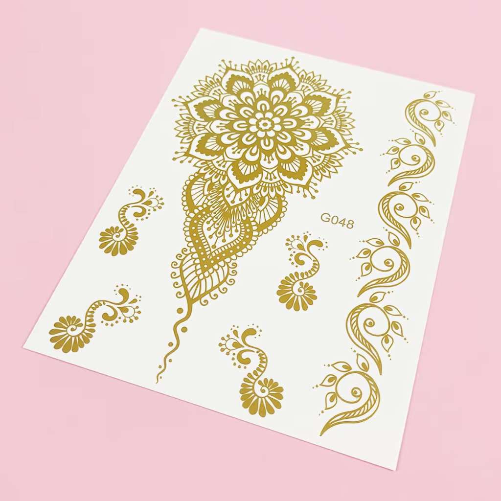 Gold mehndi floral sheet with mandala petals, paisley curves, and bracelet-like accents.