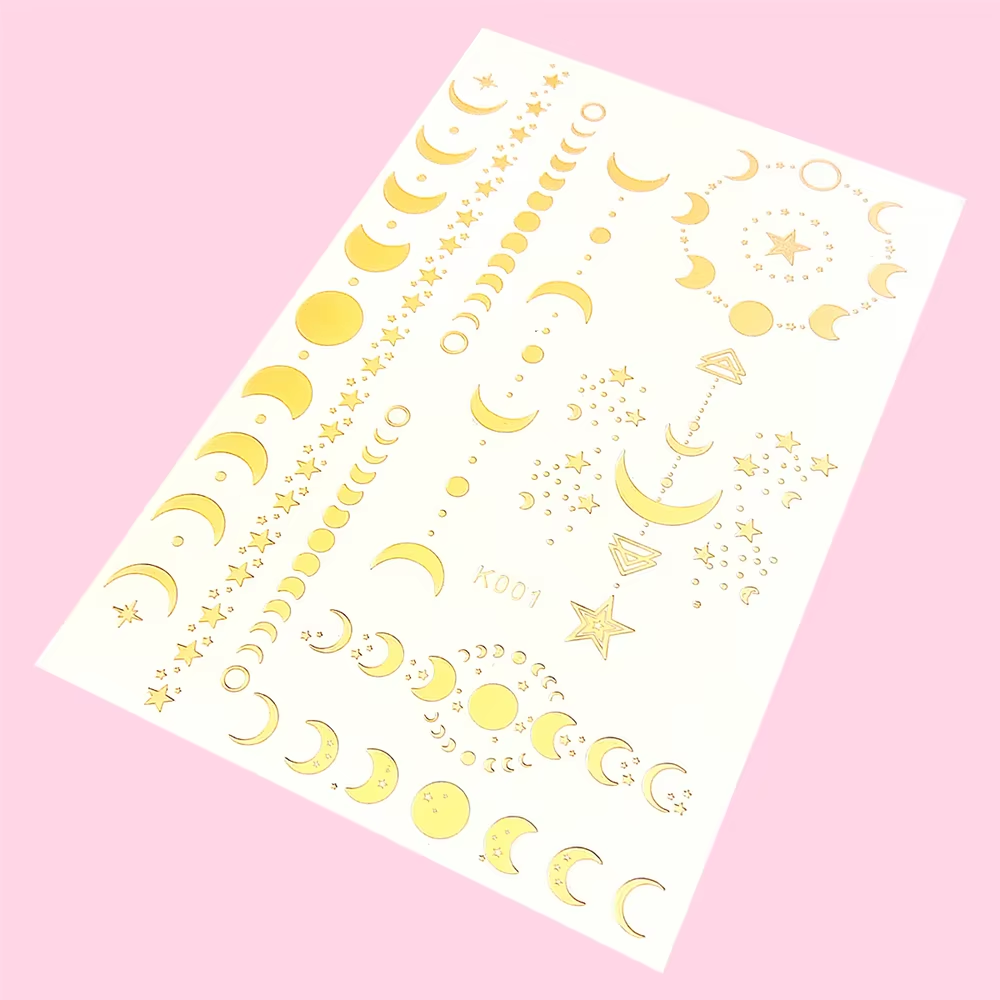 Gold celestial sheet with moons, stars, dots, and tiny decorative accents.
