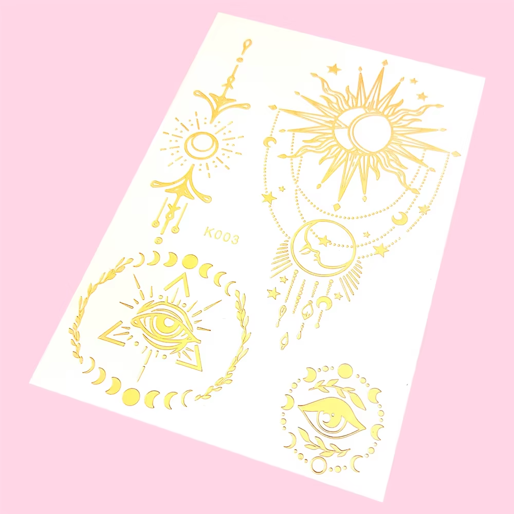 Gold sun-and-moon sheet with radiant celestial motifs and circular mandala accents.