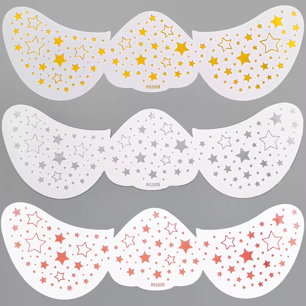 Tiny star-and-heart face accent sheet in gold, silver, and rose tones.