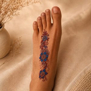 Colorful floral paisley temporary tattoo worn on the foot