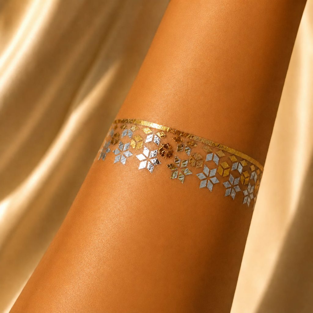 Metallic ornamental band temporary tattoo worn around the arm