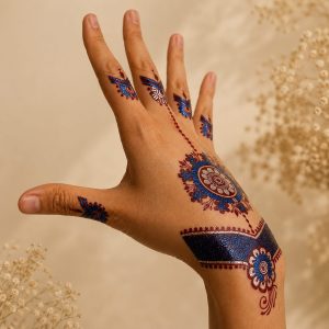 Blue and red geometric temporary tattoo shown on the wrist