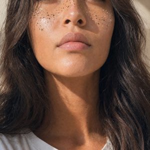 Tiny mixed accent face temporary tattoos shown on the cheek from a side view
