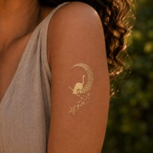 Gold moon floral temporary tattoo detail shown on the shoulder