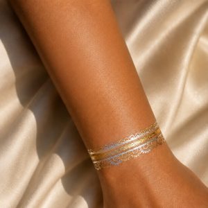 Metallic ornamental band temporary tattoo worn on the wrist