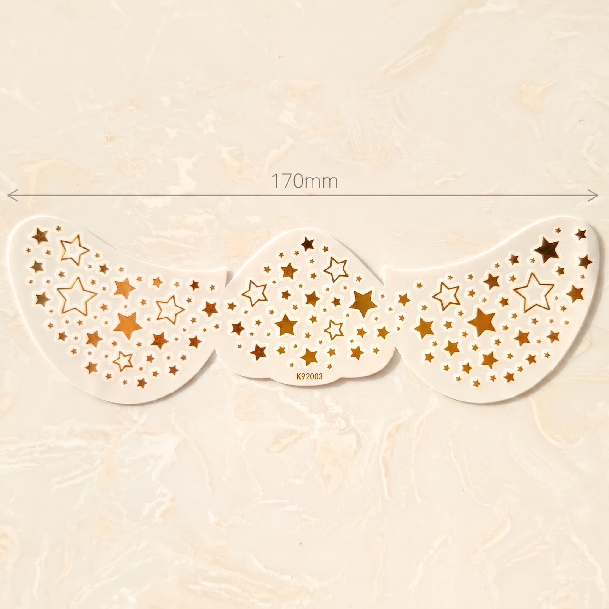 Tiny Metallic Star Face temporary tattoo sheet with size reference